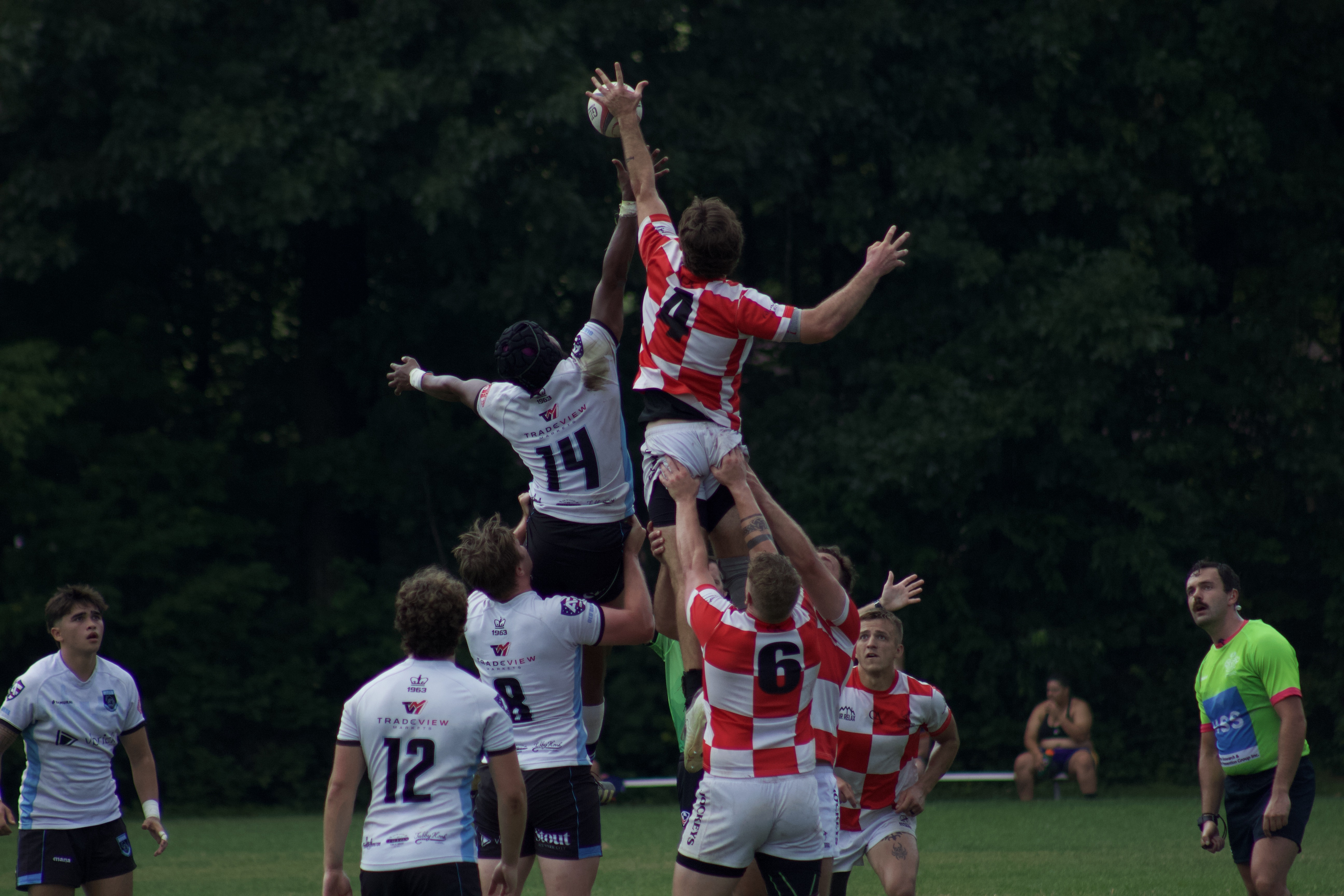 Rugby lineout — player rises above the pack to claim the ball