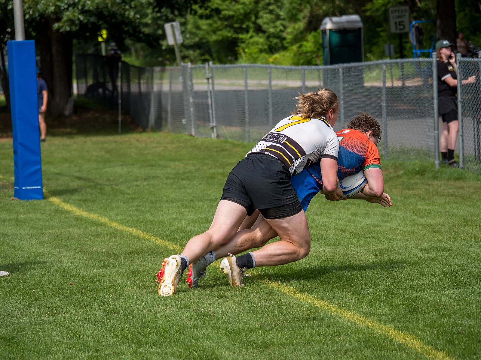 Try-line tackle at the post pad — men's club final